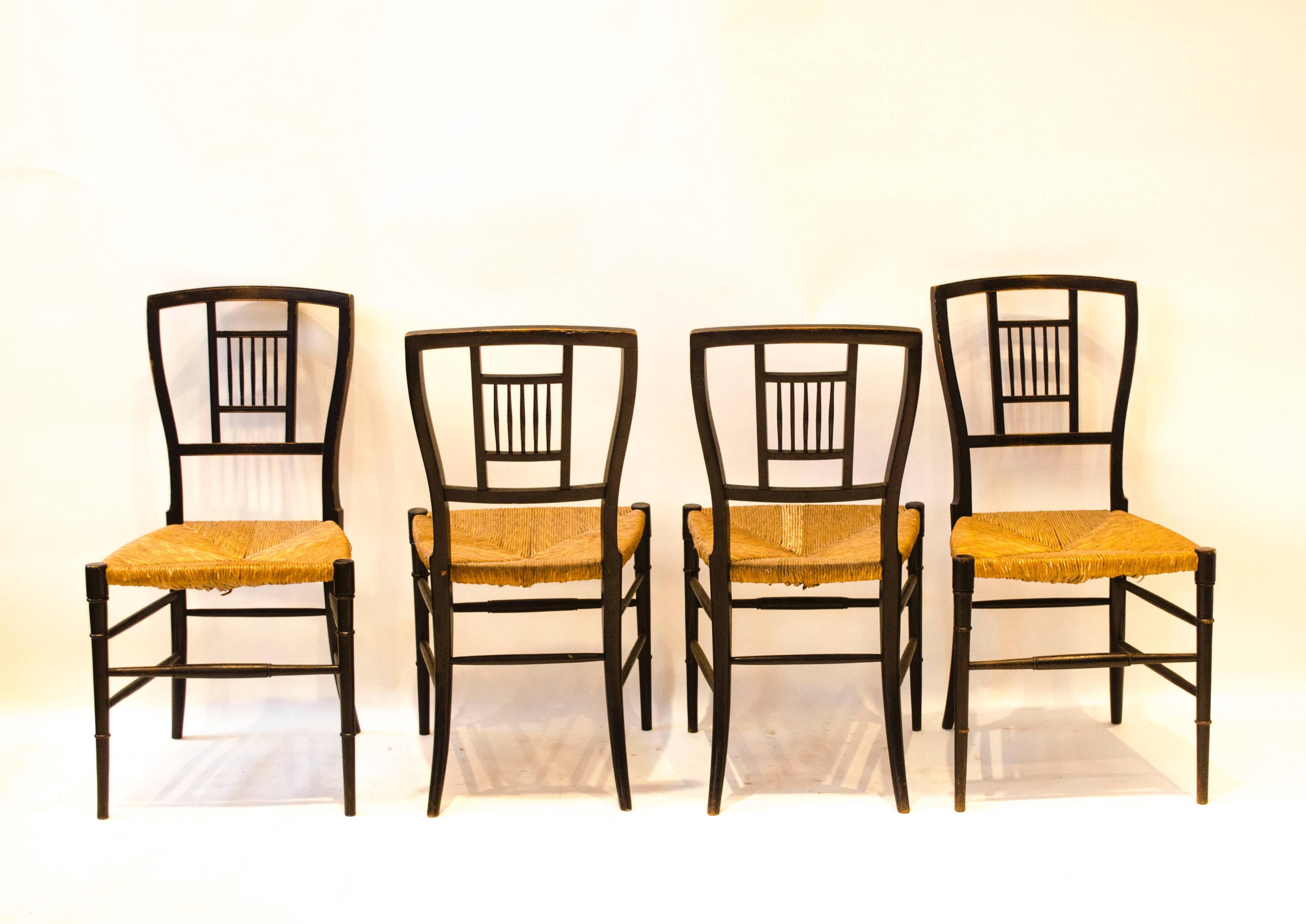 English E W Godwin. A Set of Four Anglo-Japanese Ebonised Rush Seat Chairs