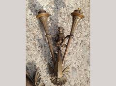 An exceptional pair Bronze wall lights of a Merboy riding a mythical Dolphin