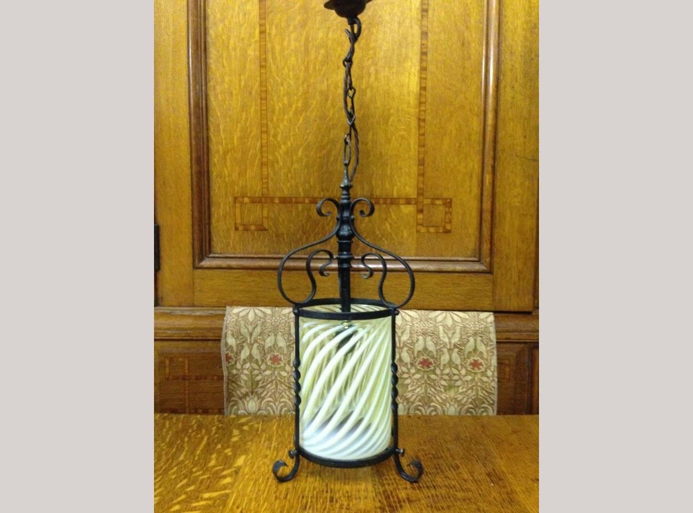 James Powell. Attributed.
An Arts and Crafts iron lantern retaining the Original Swirling Vaseline/Uranium Glass shade.
Measures: Height 17