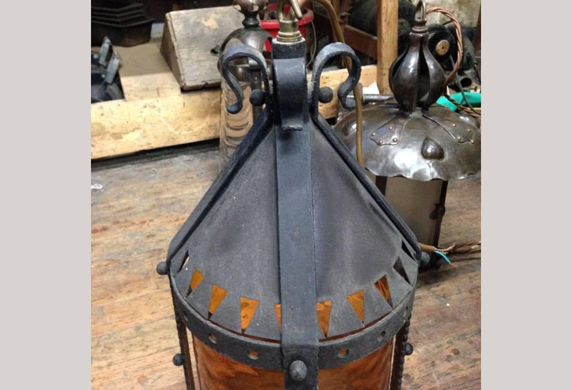 Hand-Crafted A Large Arts and Crafts Iron Lantern Retaining the Original Dappled Amber Shade. For Sale