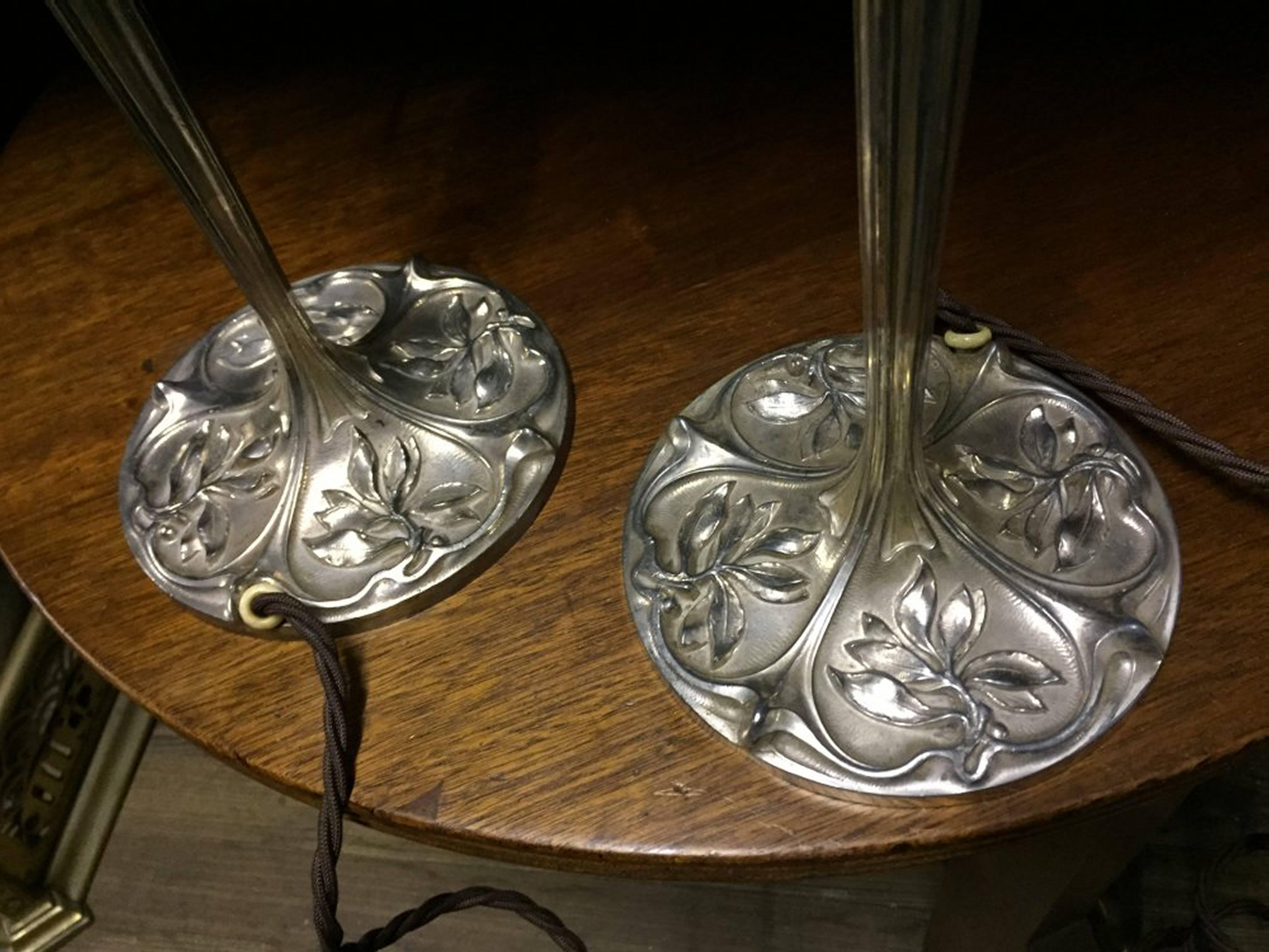 20th Century A Pair of Arts and Crafts Silver Plated Table Lamps With Stylised Floral Details For Sale