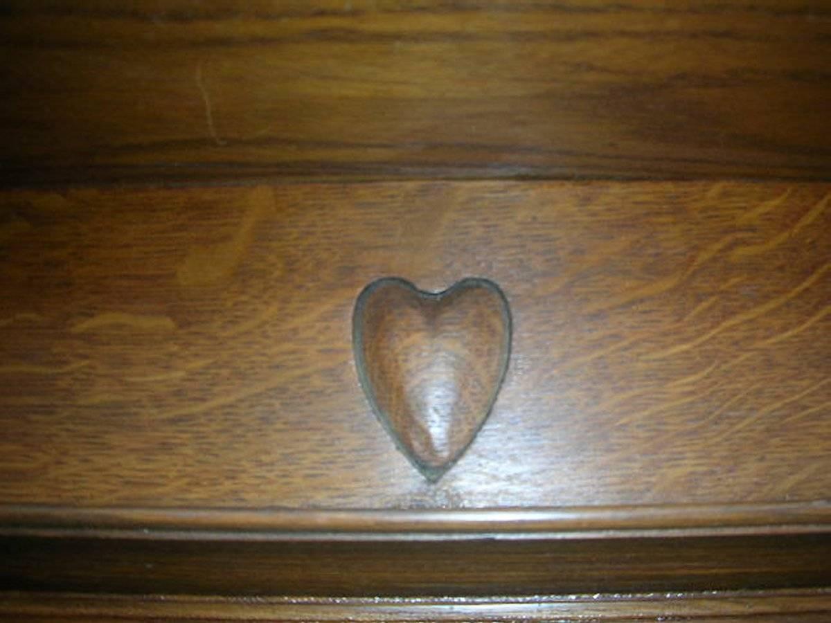 Hand-Crafted Arts & Crafts Oak Fire Surround by Shapland and Petter with five carved hearts For Sale