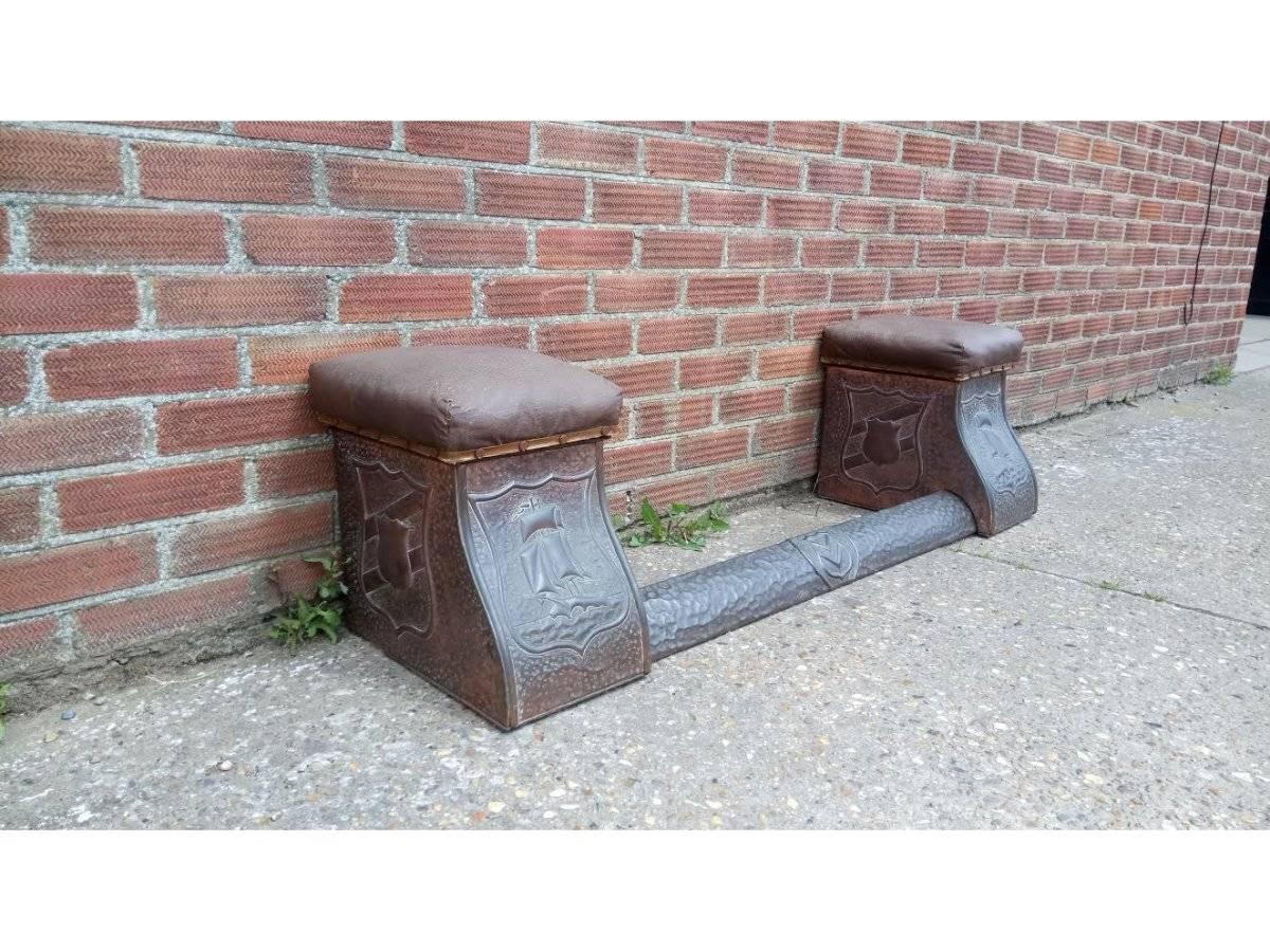 A matching Arts and Crafts fire place set with an adjustable club style fender with a seat to each side. The seats pop off with storage below including the original matching fire screen with embossed galleons and shields.
Measures: Fender seat