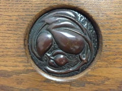 Shapland and Petter, an Arts & Crafts Hanging Oak Bookcase with Copper Plaque