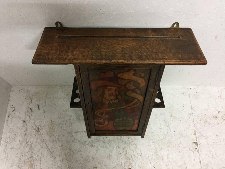 Liberty and Co. an Oak Smokers Wall with a Gentleman Smoking a