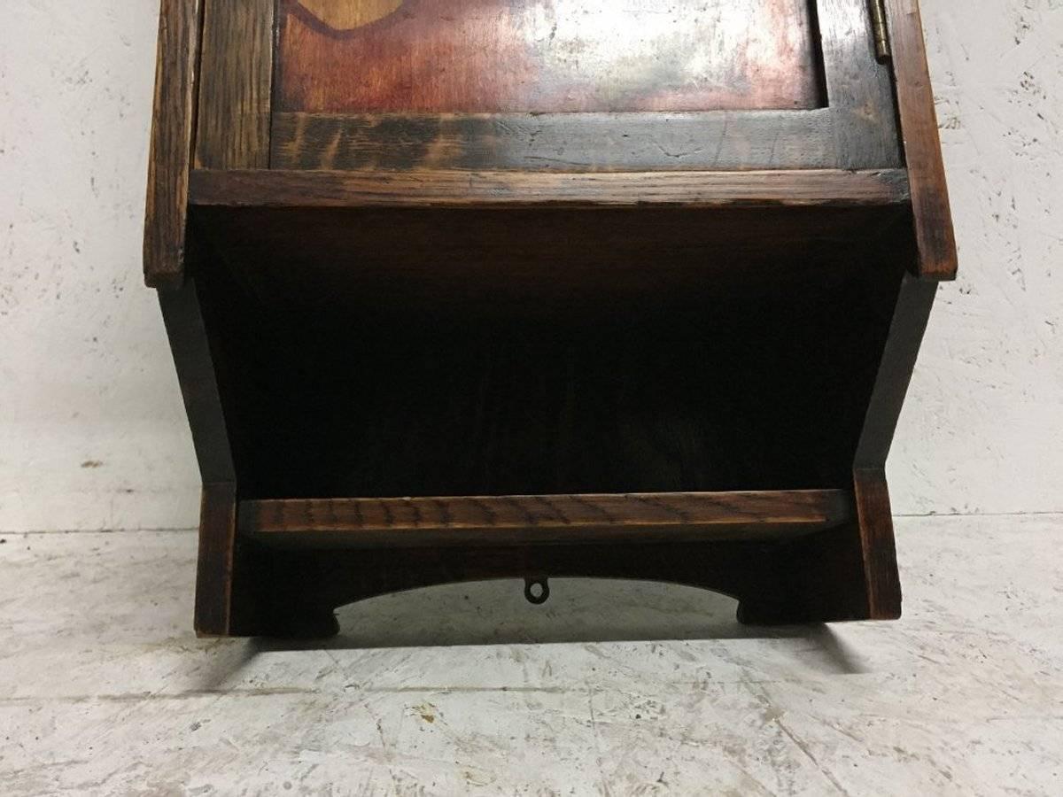 Arts and Crafts Liberty & Co. an Oak Smokers Wall Cabinet with a Gentleman Smoking a Pipe