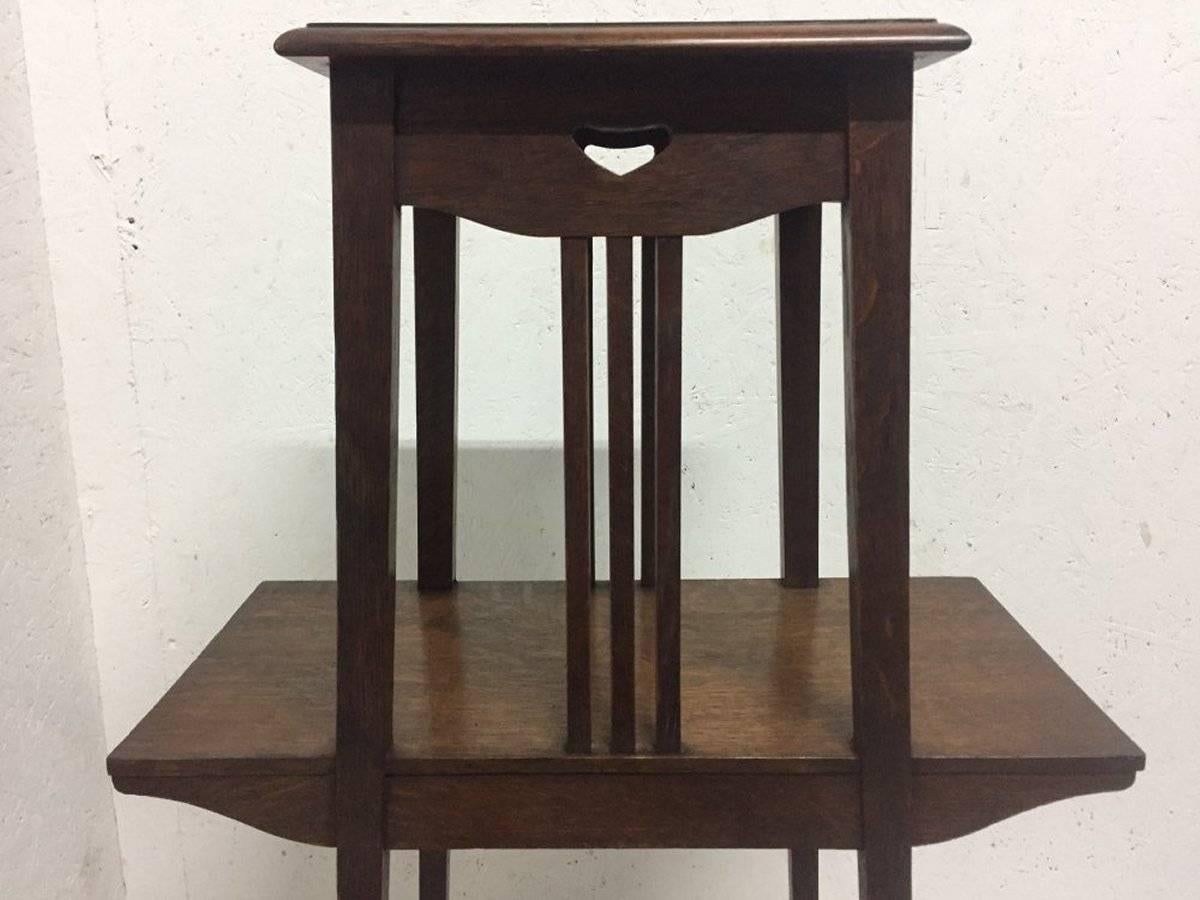 Arts and Crafts Liberty & Co. An Oak Plant Stand with Pierced Heart in the Style of C F A Voysey For Sale