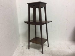 Liberty & Co. An Oak Plant Stand with Pierced Heart in the Style of C F A Voysey