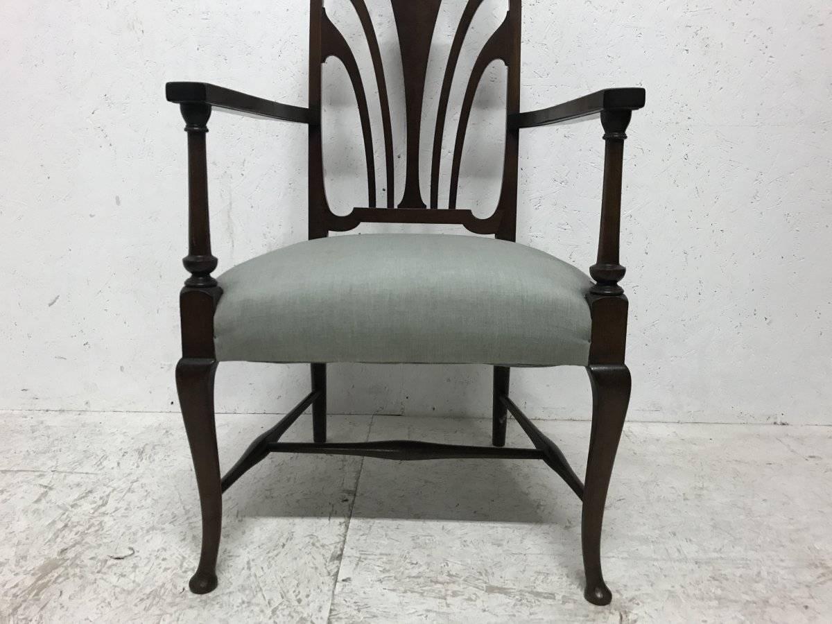 20th Century Liberty & Co. An Arts & Crafts Mahogany Armchair with an Art Nouveau Style Back For Sale