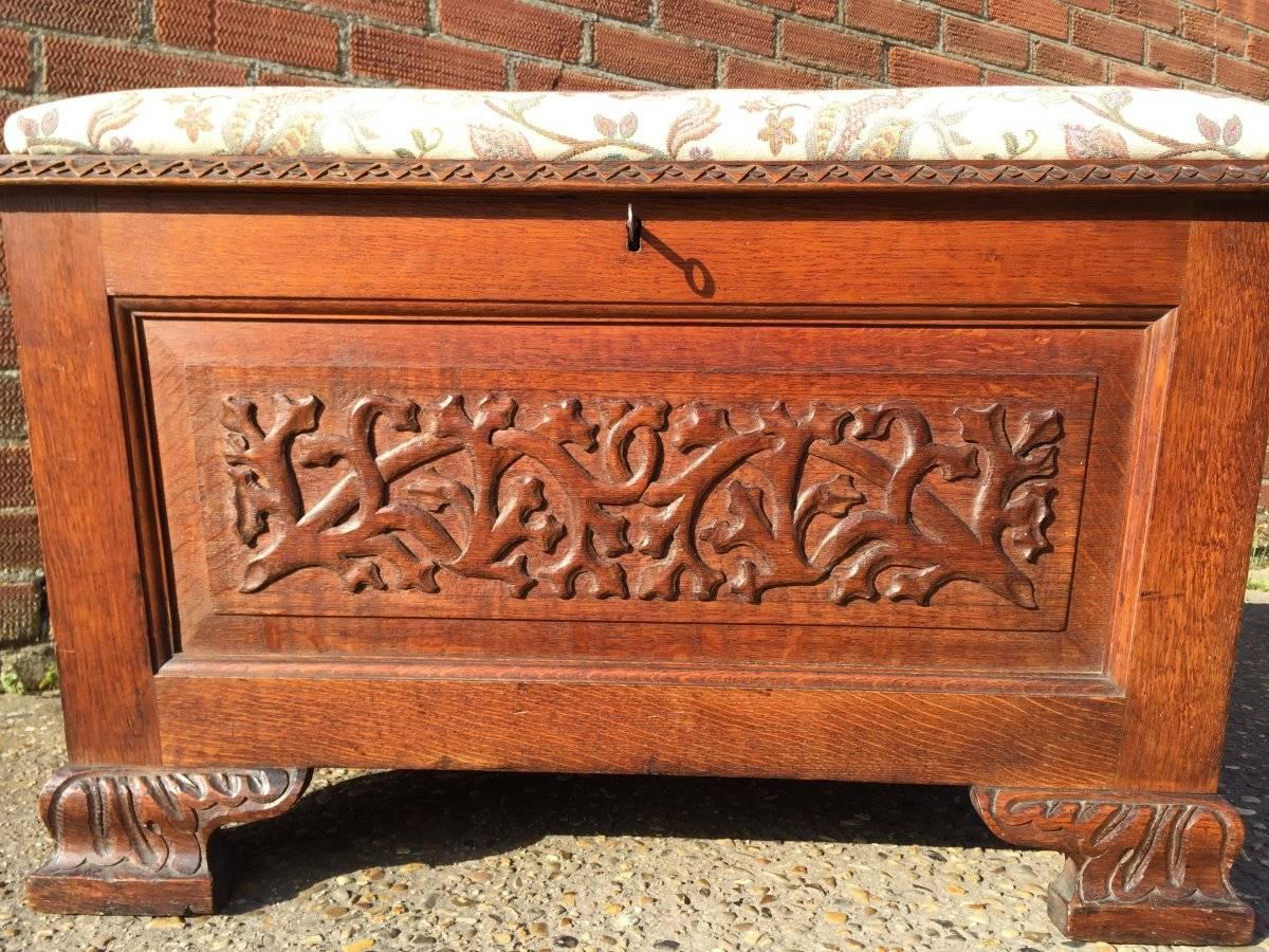 English Arts and Crafts Ottoman with All Round Carved Floral Details and Storage Inside For Sale