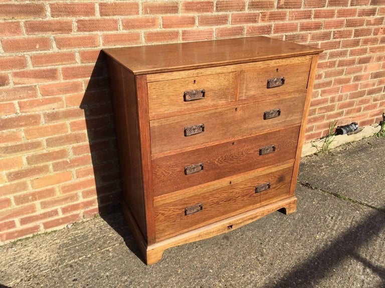 Arts and Crafts Oak Chest of Drawers with Copper Handles and a Pierced