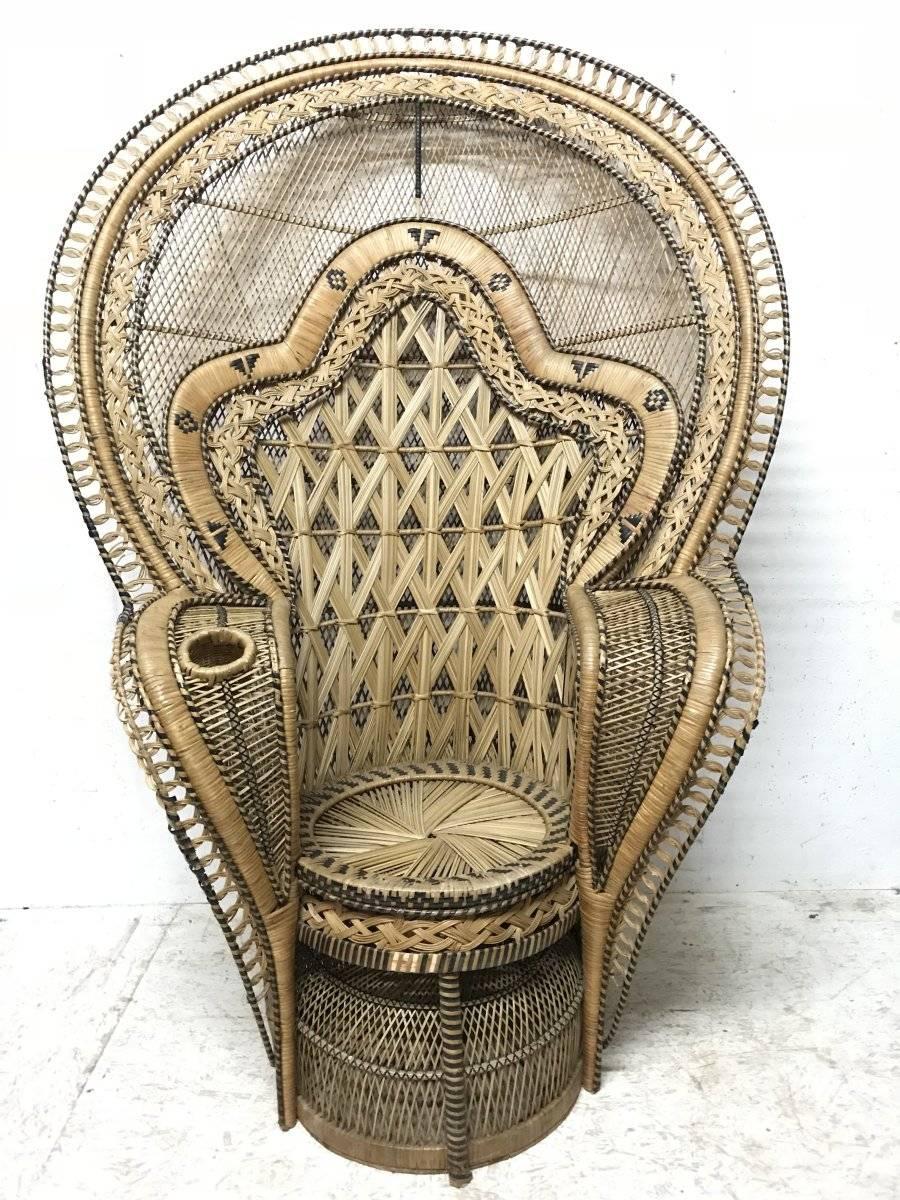 The King of peacock armchairs. An extremely rare and exceptional cane throne armchair, the type and style made famous by French director Just Jaeckin and Dutch actress Sylvia Kristel in the cult film Emmanuelle. This Peacock armchair is over 16