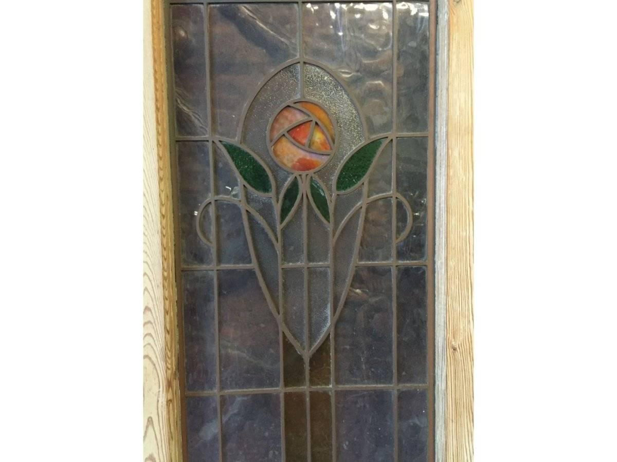A rare set of four Arts & Crafts stained glass doors with stylized Glasgow roses inset into copper edging. Copper edging makes it considerably stronger than using lead edging, and was chosen for heavier use than normal, like a public building, very