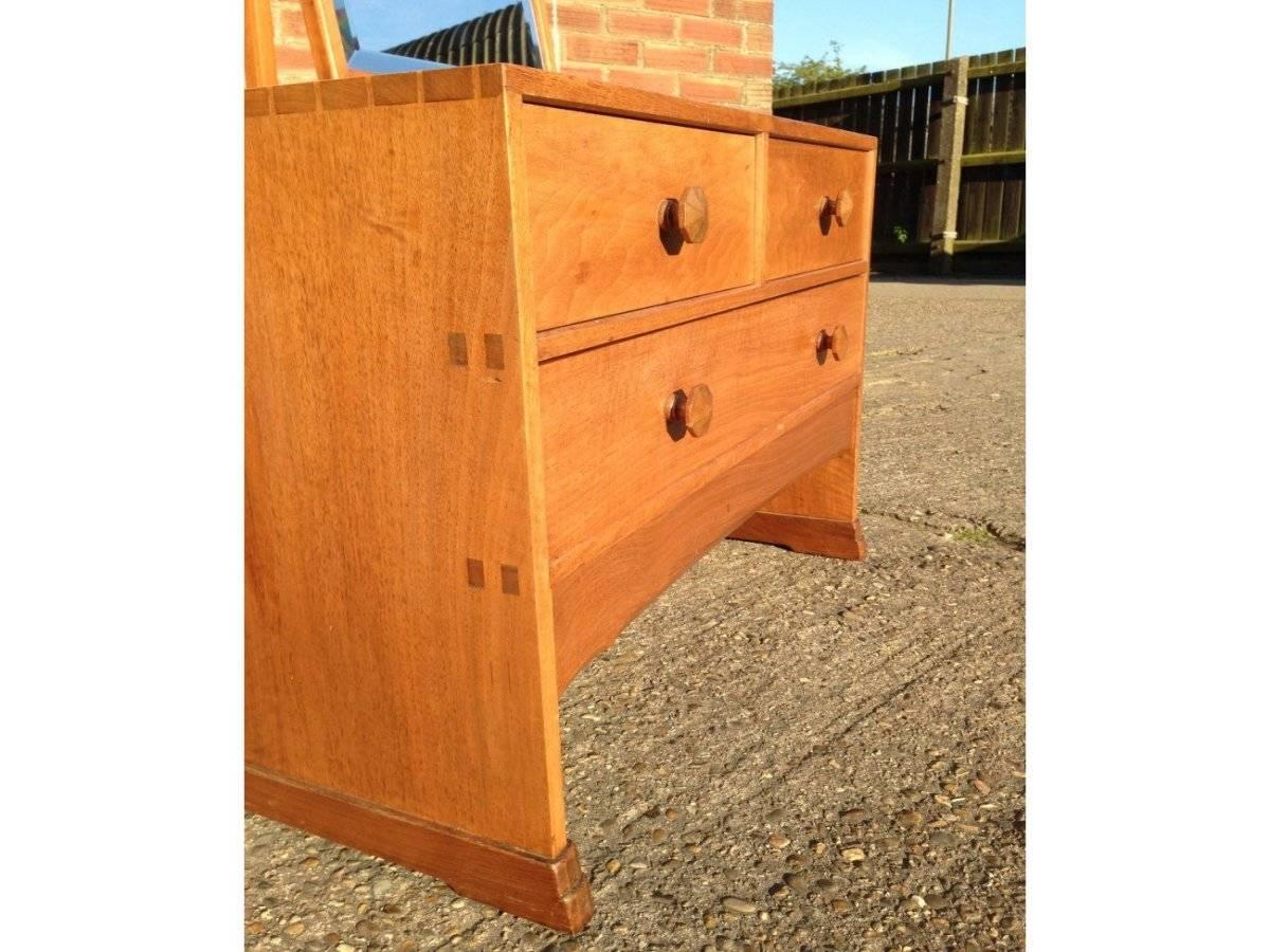 Edward Barnsley. An Arts & Crafts Cotswold School handmade walnut dressing table, with through tenon joints and exposed dovetail details to the sides, stood on sledge style feet.