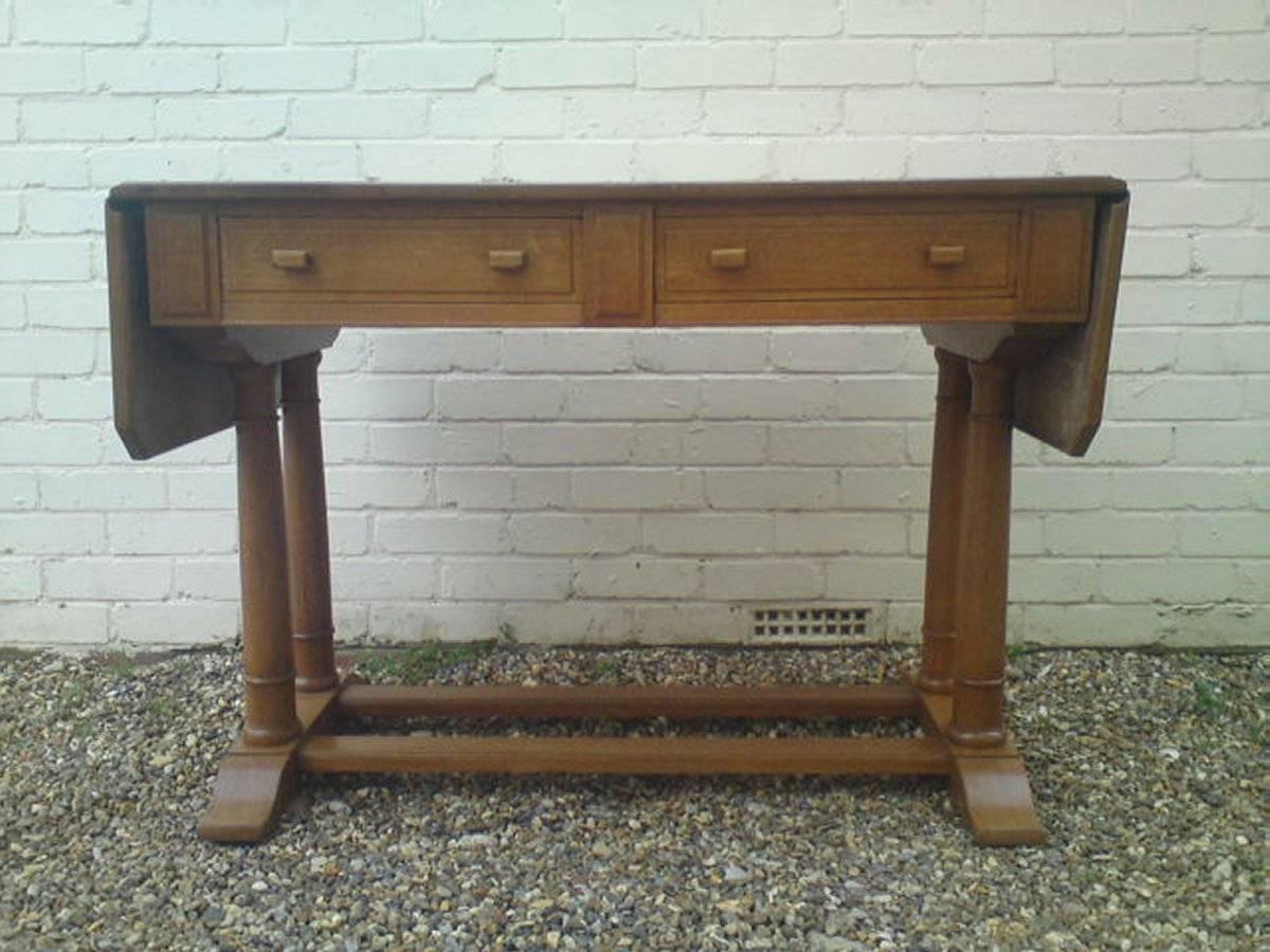 A rare Arts and Crafts desk designed by Philip Tilden and Ambrose Heal, made by Heals of London. Philip Tilden was employed by Winston Churchill in the 1920s as chief architect to the renovation of Chartwell in Kent, Churchill's weekend residence