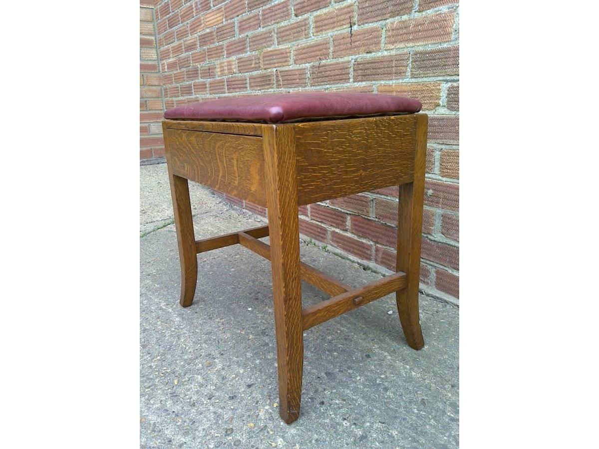 Heals attributed, an Arts & Crafts Cotswold School oak stool with secret drawer designed with no handle so it looks hidden, with a little chamfer on the bottom inside the drawer front which you can feel but not see to open.
With subtle splayed out