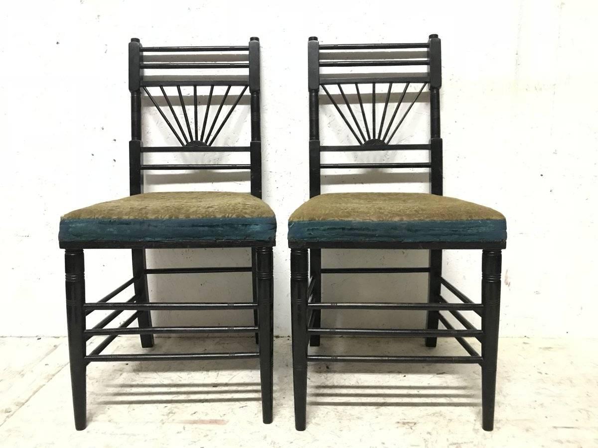 E W Godwin attributed. 
A pair of Anglo-Japanese side chairs with semicircular style radiating sun burst details to the back.
The design of these side chairs follow the dining chairs Godwin designed for Dromore Castle, Ireland for Lord Limerick. The