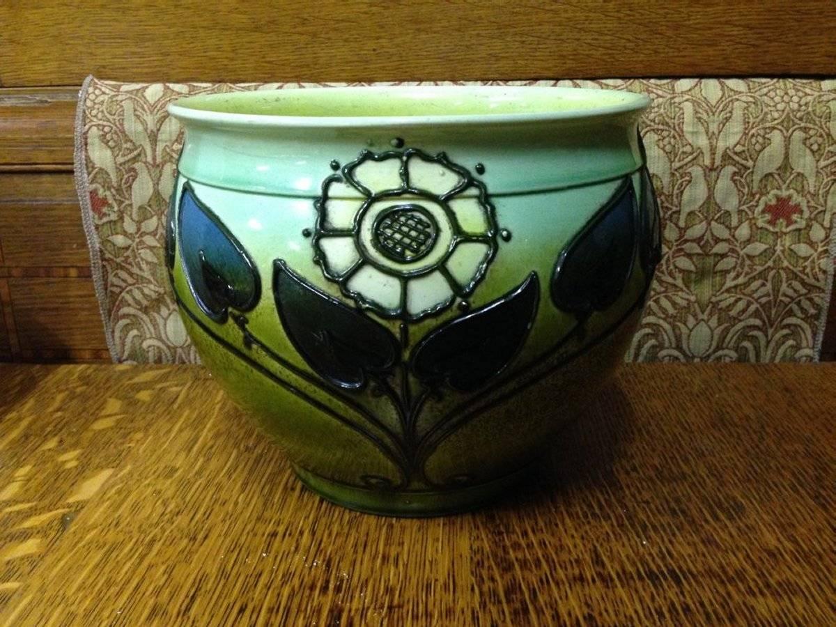 Wardle. An Arts & Crafts planter with tube line decoration of stylised sun flowers and leaves, in strong rich colors.