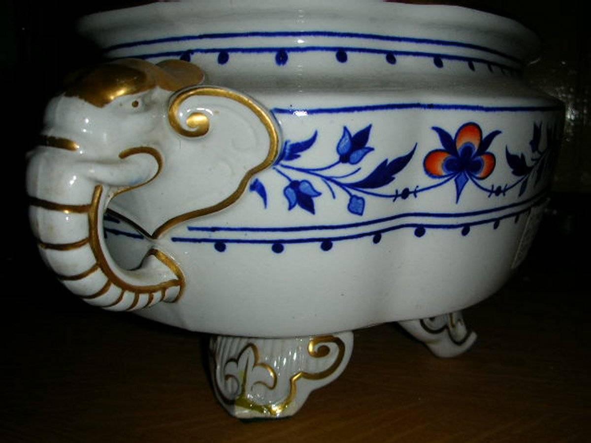 Dr C Dresser, attributed made by Royal Worcester. A blue and white floral elephant tureen with gilt highlights.
A script capital 'W' in gold is present which was used on some of the finest examples of Royal Worcester.
'T' under the circle dates it