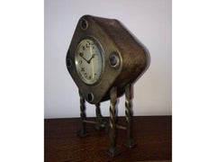 An Arts & Crafts Silver Plated Mantel Clock with Mottled Blue Ruskin Jewels