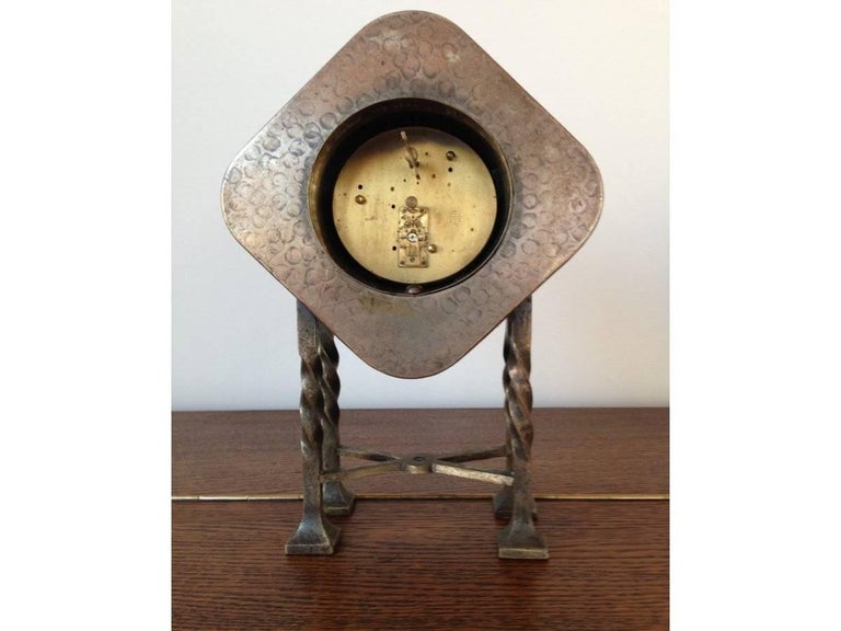 An Arts and Crafts Silver Plated Mantel Clock with Mottled Blue Ruskin