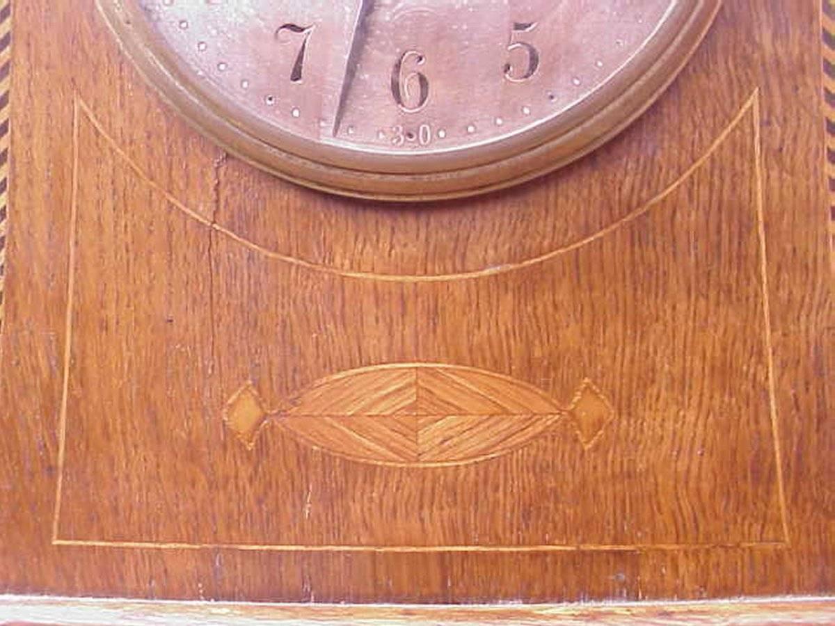 Hand-Crafted Liberty and Co Attributed. An Arts & Crafts Oak Mantle Clock with Chevron Inlays