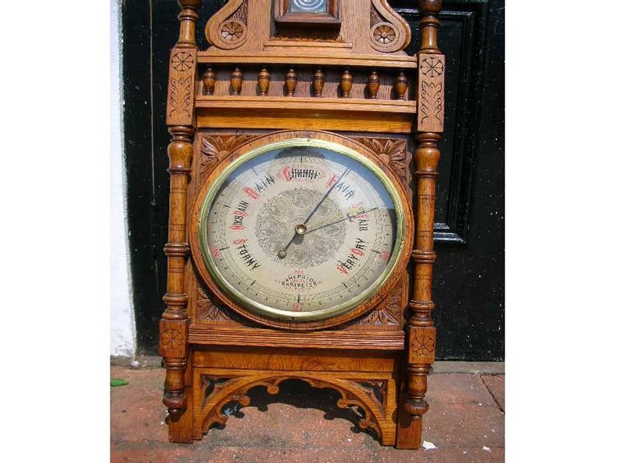 British A Large Gothic Revival Carved Oak Barometer with a Rare Snail Tail Thermometer For Sale