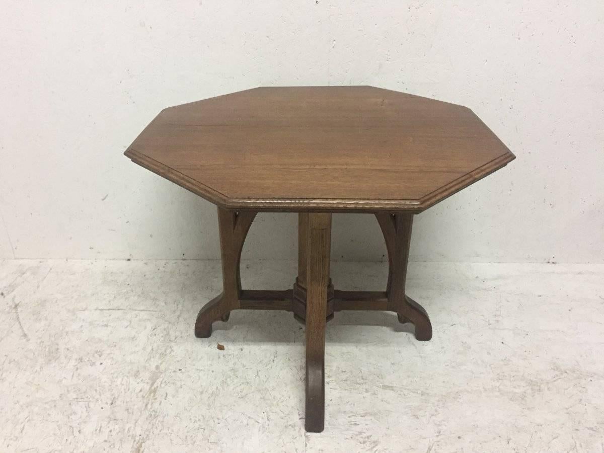A W N Pugin Attributed.
An exceptional Gothic Revival oak centre table. The Octagonal top with moulded edge and a conforming octagonal central upright support joining an arched under tier which are let into the legs exposing those joints. The lower