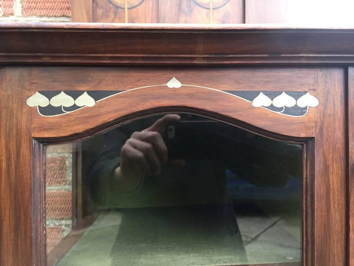 English Waring and Gillows, an Exceptional, Bow Fronted Inlaid Display Cabinet For Sale