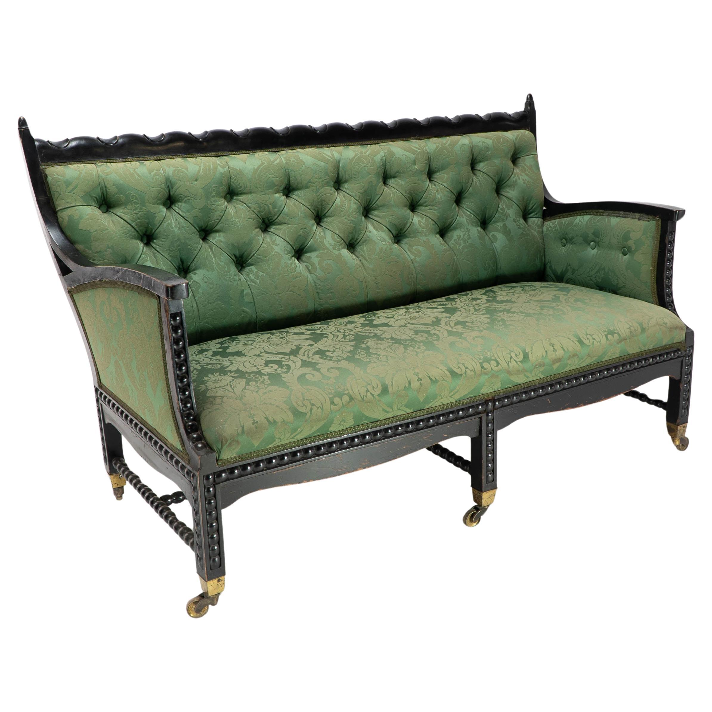 Philip Webb for Morris & Co. Aesthetic Movement Ebonised Settee with Bobbins