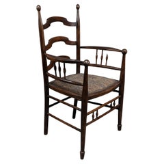 Antique Liberty & Co Attributed, an English Walnut Arts & Crafts Ladder Back Armchair
