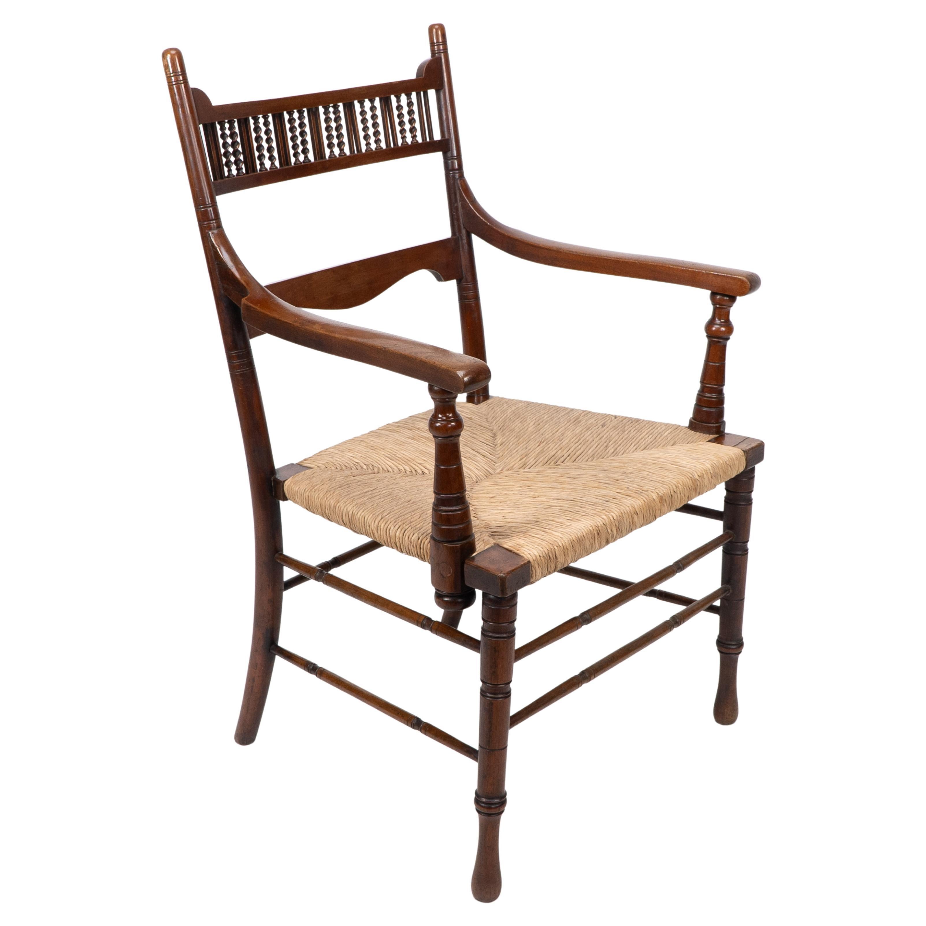 George Bell & George Freeth Roper Aesthetic Movement Walnut rush seat armchair. For Sale