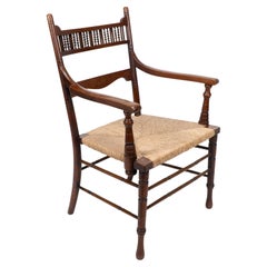 George Bell & George Freeth Roper Aesthetic Movement Fauteuil à assise en jonc de noyer.