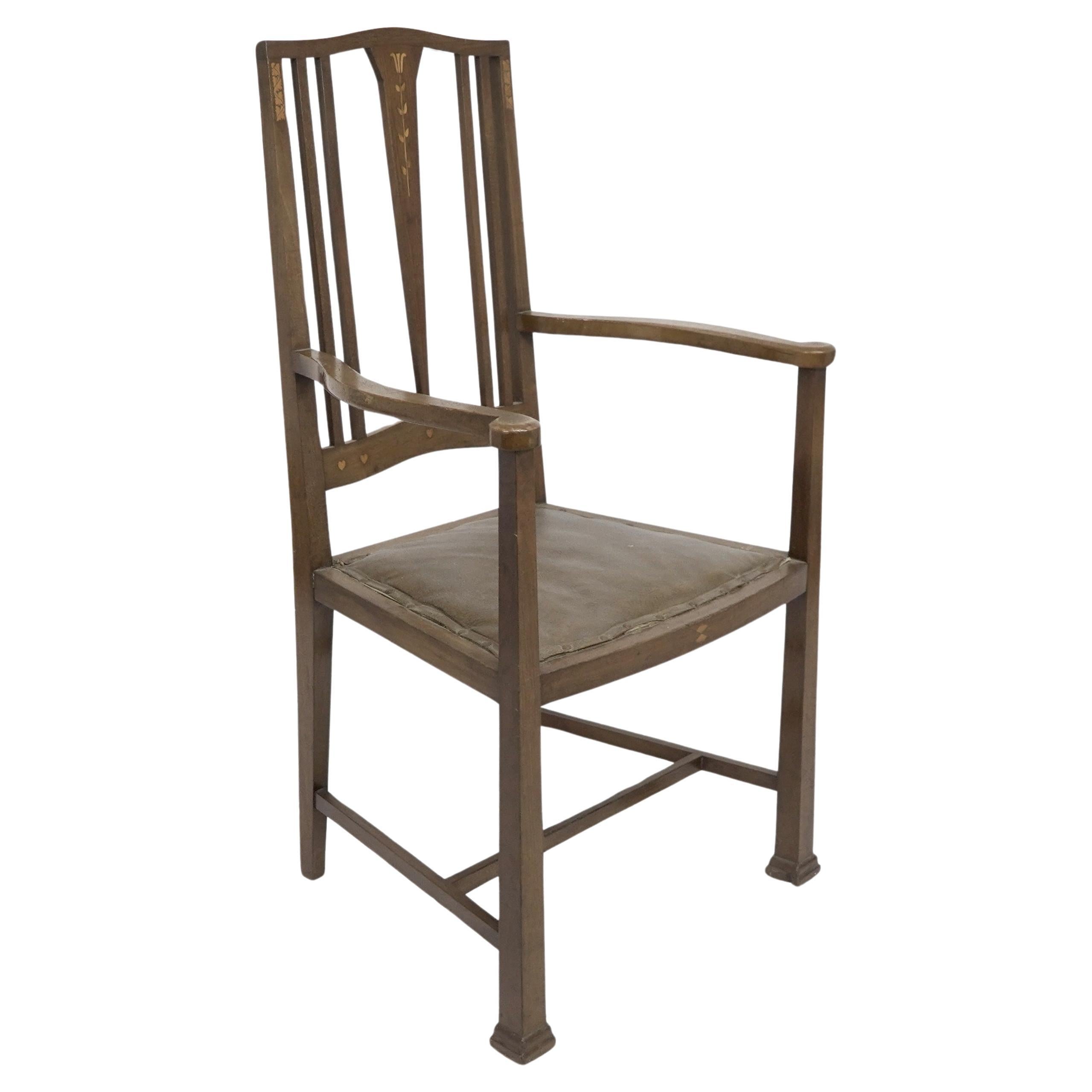 Liberty and Co. A good quality Arts and Crafts oak armchair with