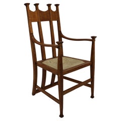 J S Henry Arts & Crafts oak dining chair with throne like caps & a sweeping back
