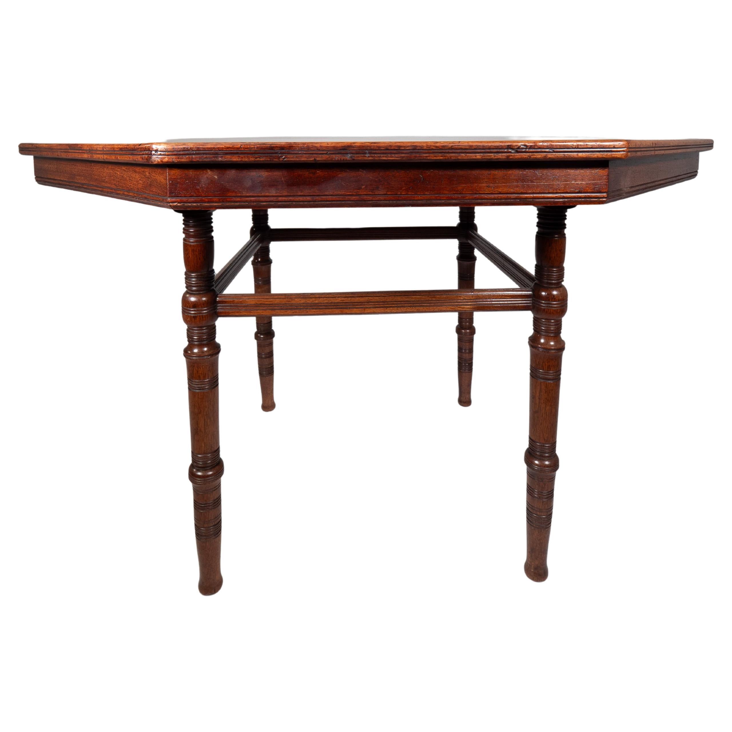 E W Godwin attributed. An Aesthetic Movement Walnut octagonal centre table For Sale