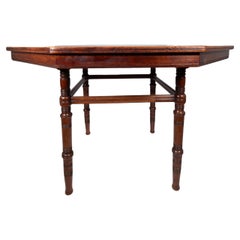 E W Godwin attributed. An Aesthetic Movement Walnut octagonal centre table