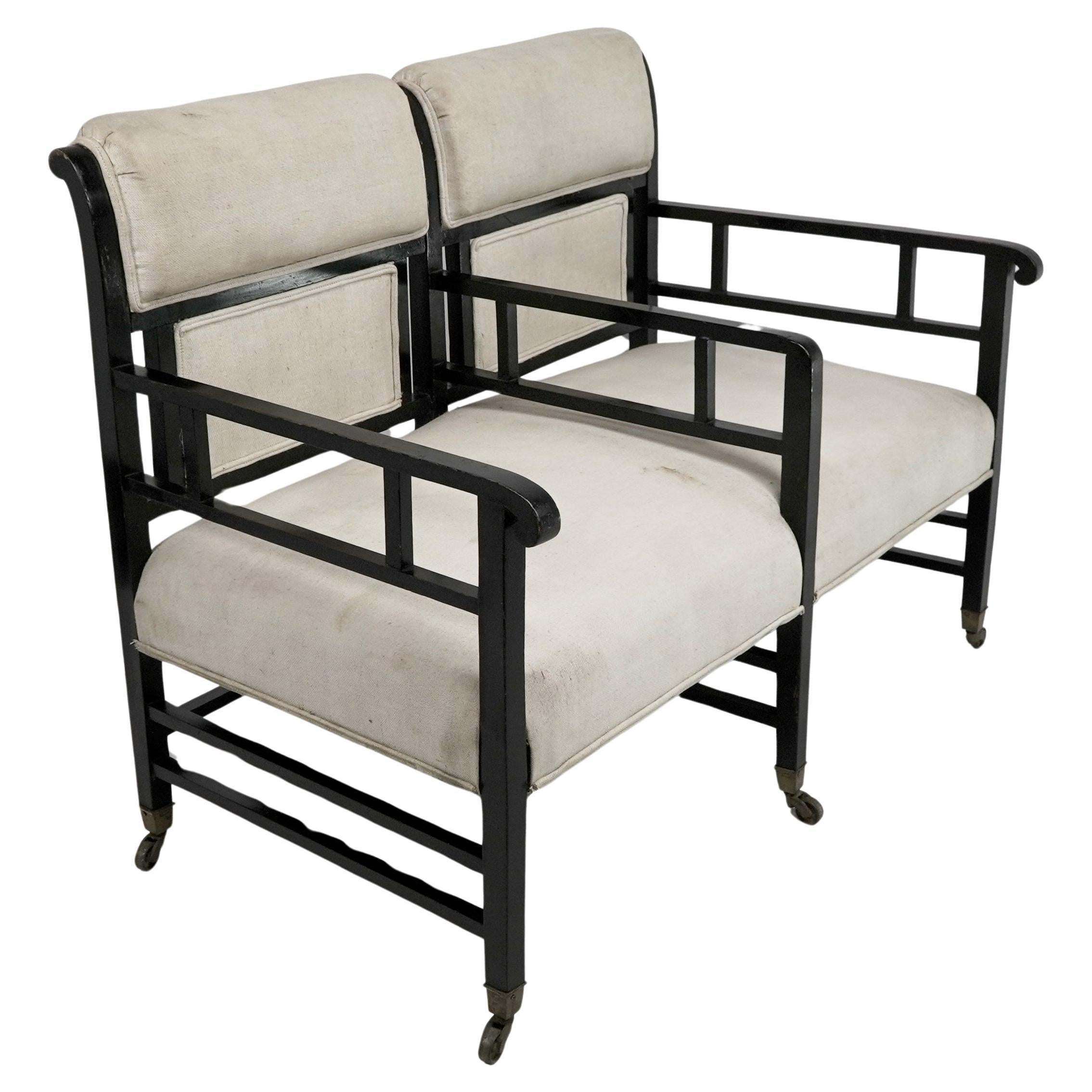 E W Godwin (attributed). An Anglo-Japanese ebonized duet or conversation settee. For Sale