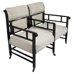 Used E W Godwin (attributed). An Anglo-Japanese ebonized duet or conversation settee.