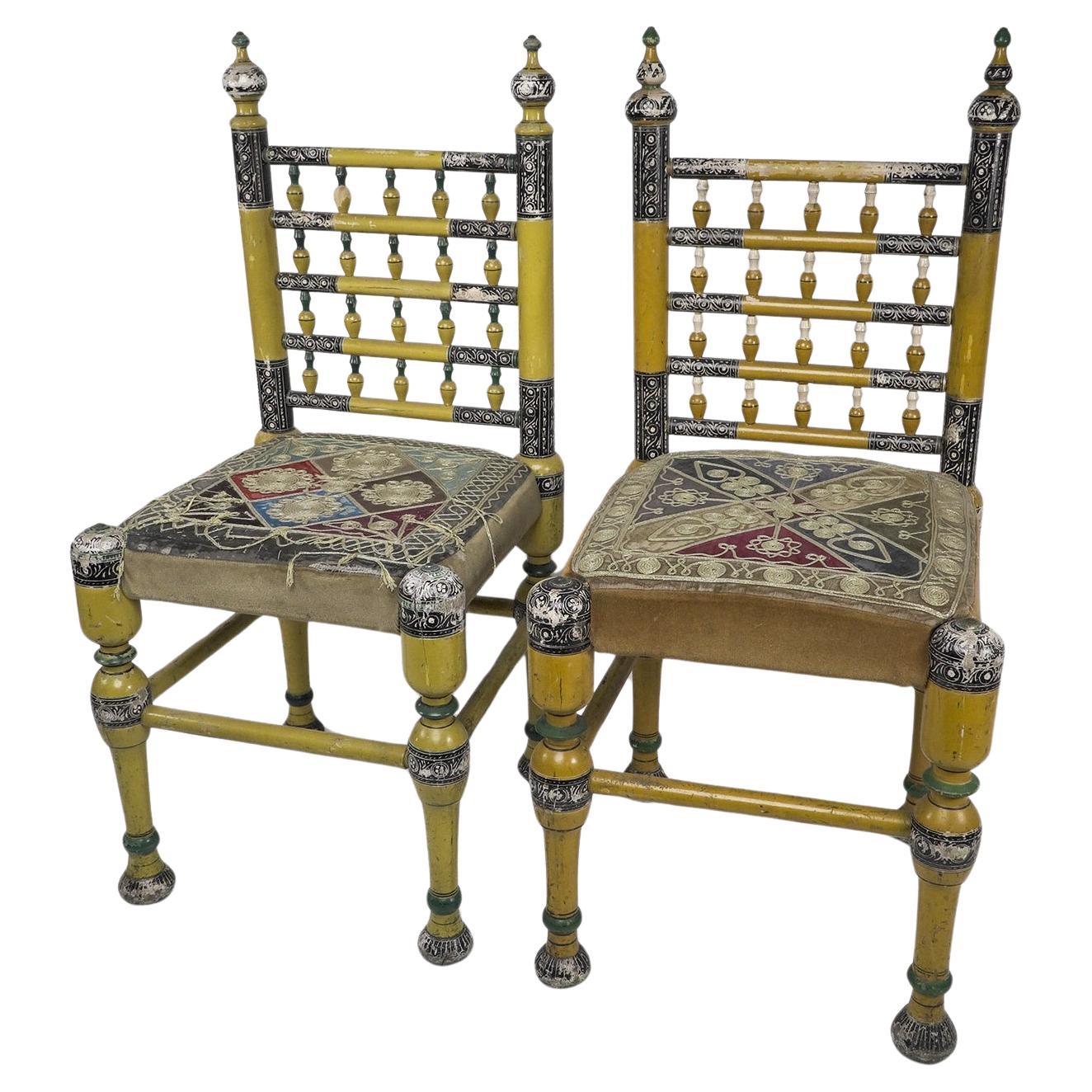 Indian Rajasthani A pair of polychrome painted chairs with gilt chord embroidery For Sale