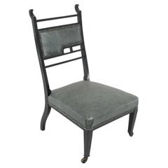 Antique An Anglo-Japanese ebonized side or nursing chair with green hide upholstery