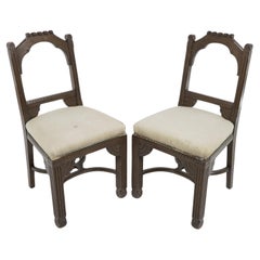 Antique R Boyd. in the style of Dr C Dresser. A pair of oak side chairs