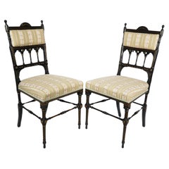 Used Whytock & Reid. A pair of Aesthetic Movement ebonized & parcel gilt side chairs.