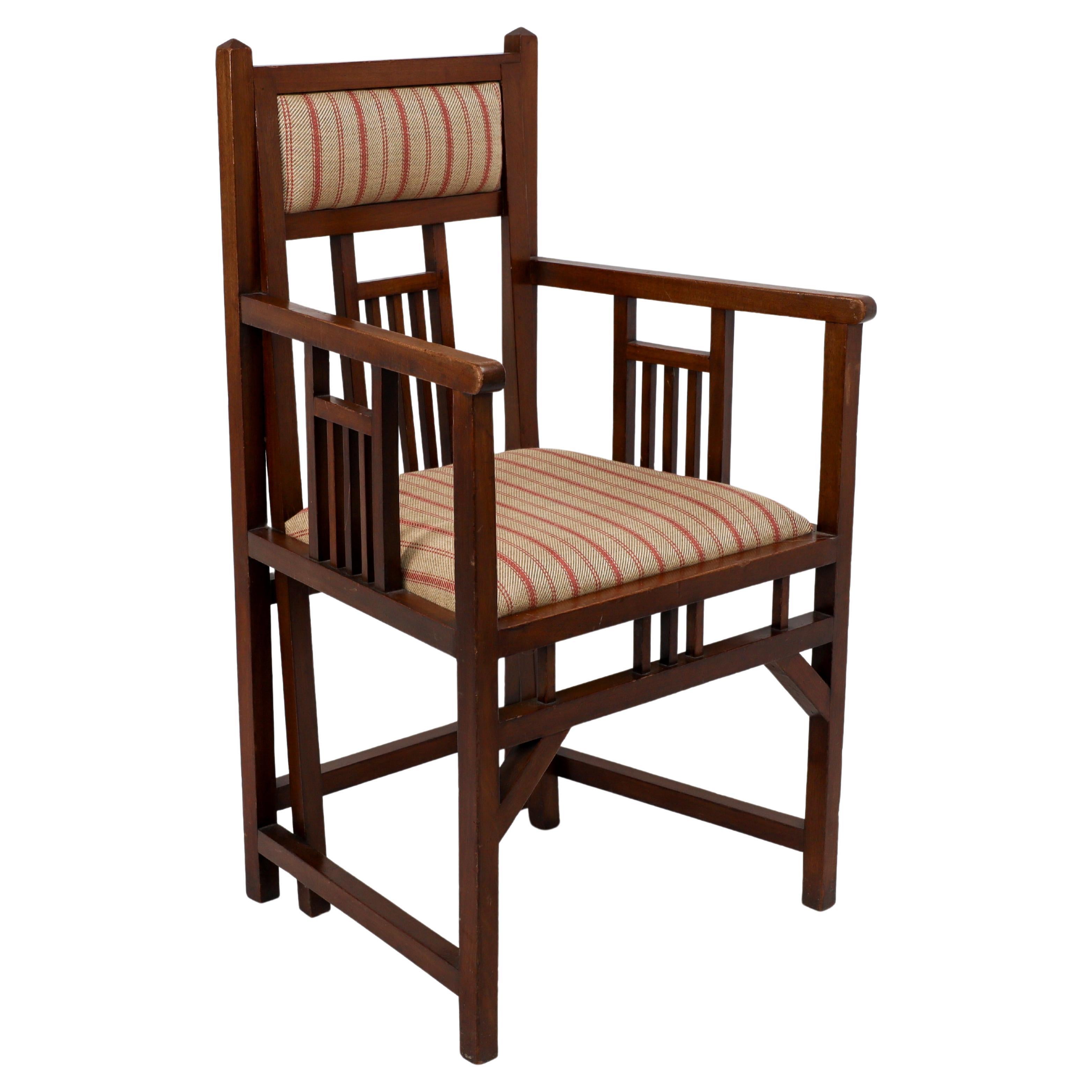 Bombay Art Furniture An Anglo-Japanese Walnut armchair with a double back leg. For Sale