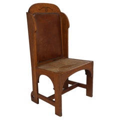 E G Punnet attributed. Probably made by William Birch. An oak wing back chair