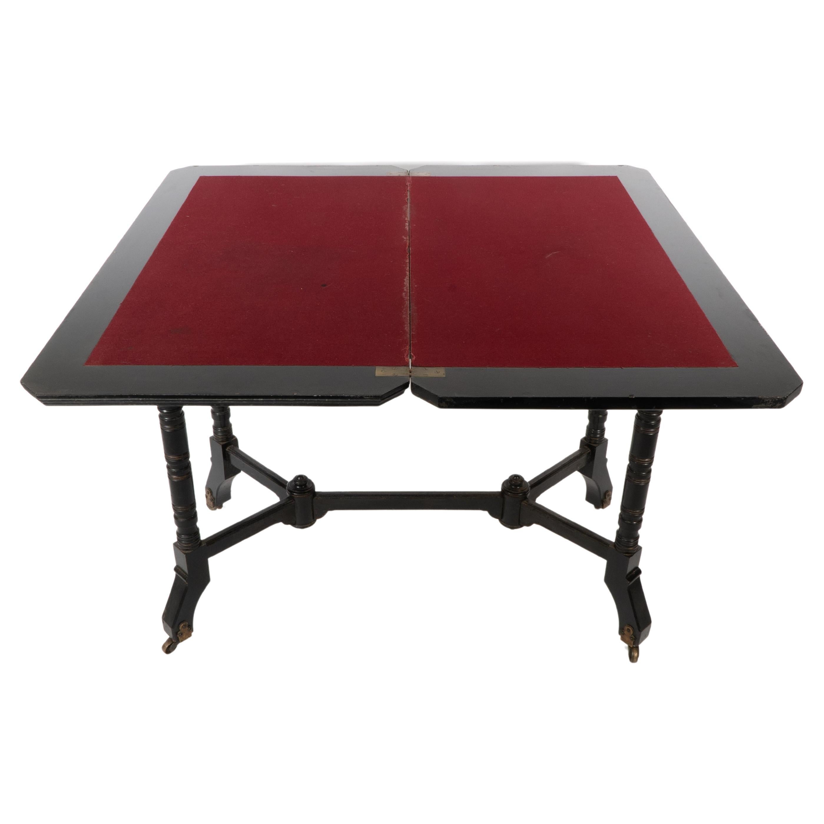 Bevan. Marsh Jones & Cribb. An Aesthetic Movement walnut ebonized card table For Sale