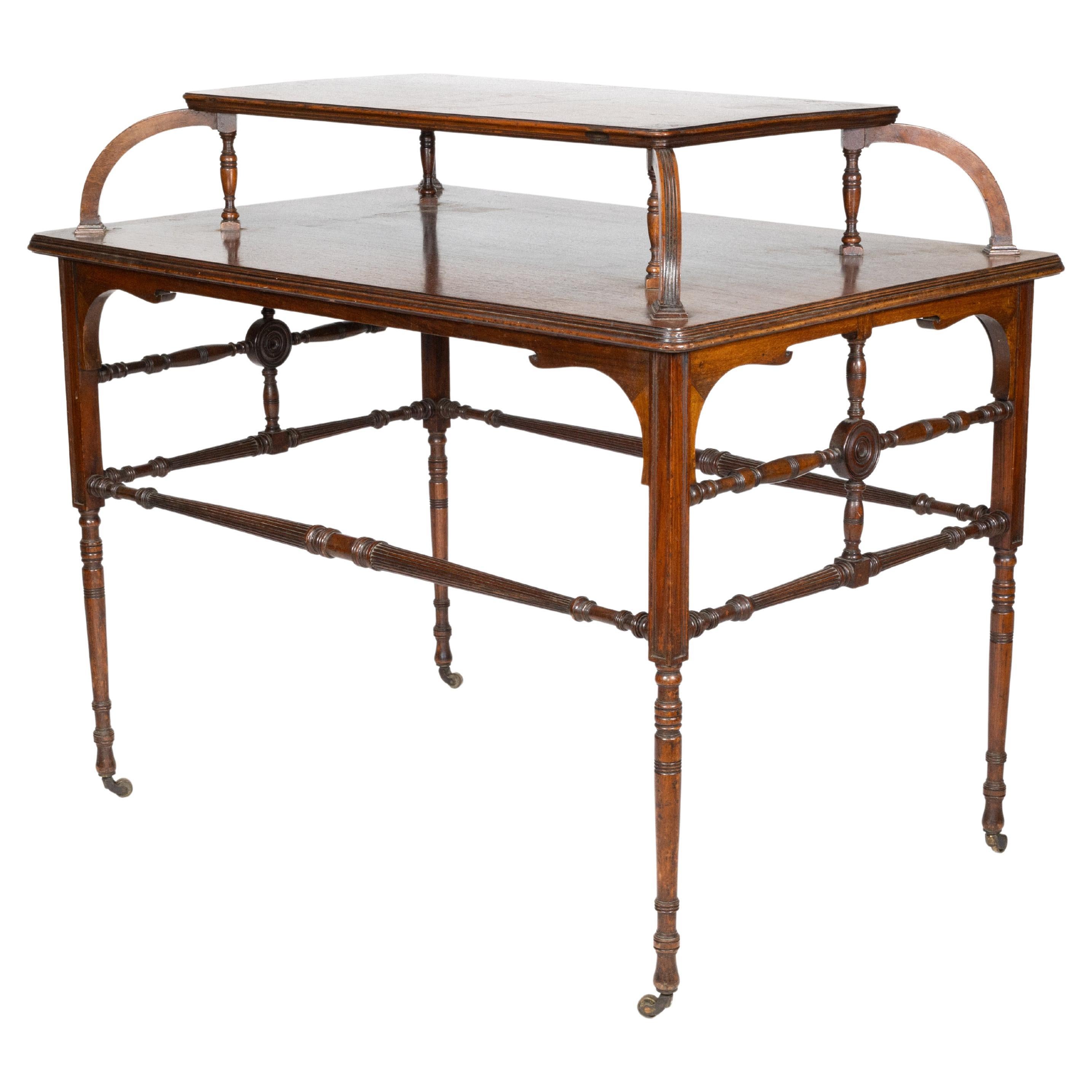 Howard and Sons. A high art Aesthetic Movement Walnut centre tea table For Sale