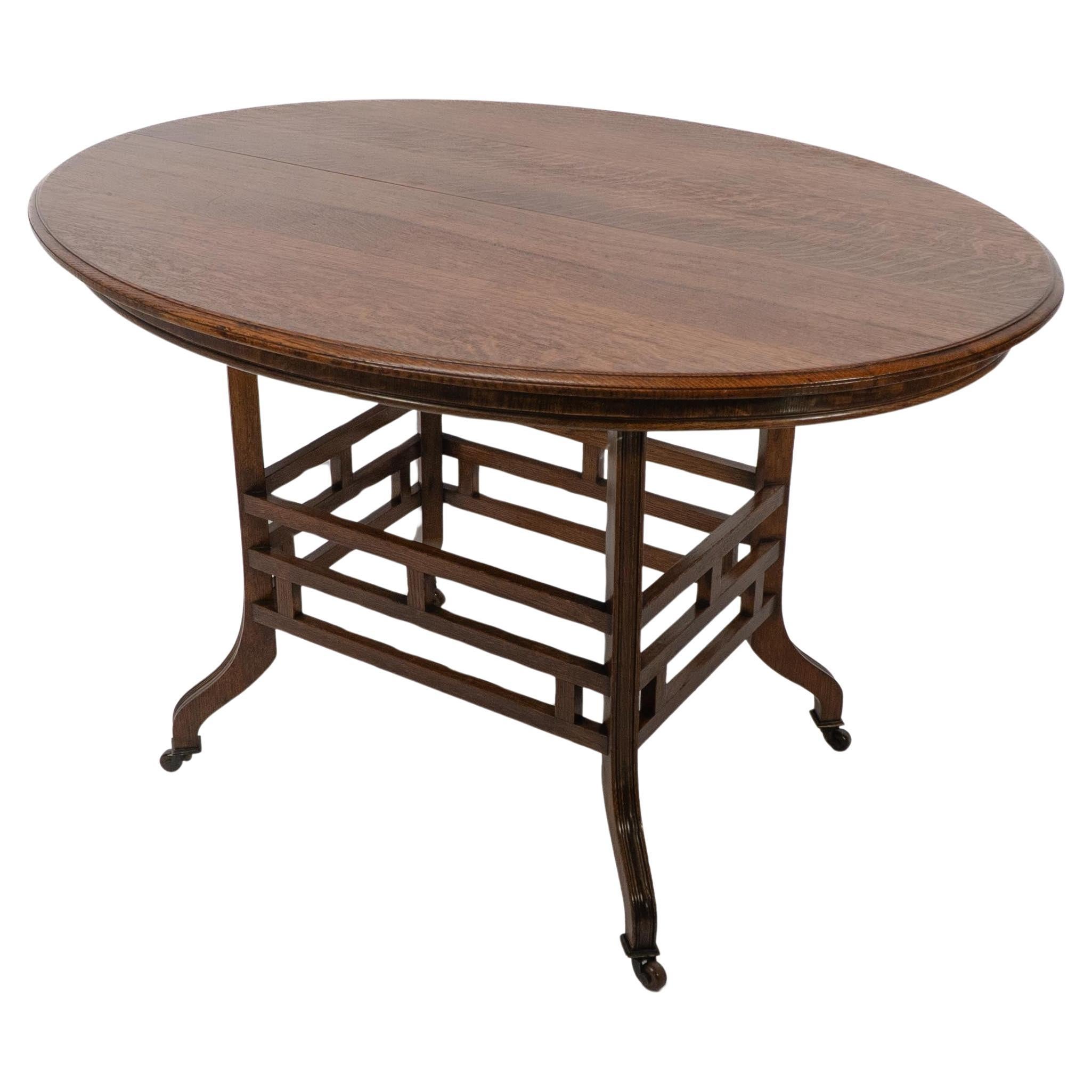 Lambs of Manchester, stamped Lambs. A rare Anglo-Japanese oak oval centre table For Sale