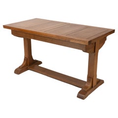 Heals & Son. An Arts & Crafts narrow oak extending dining table