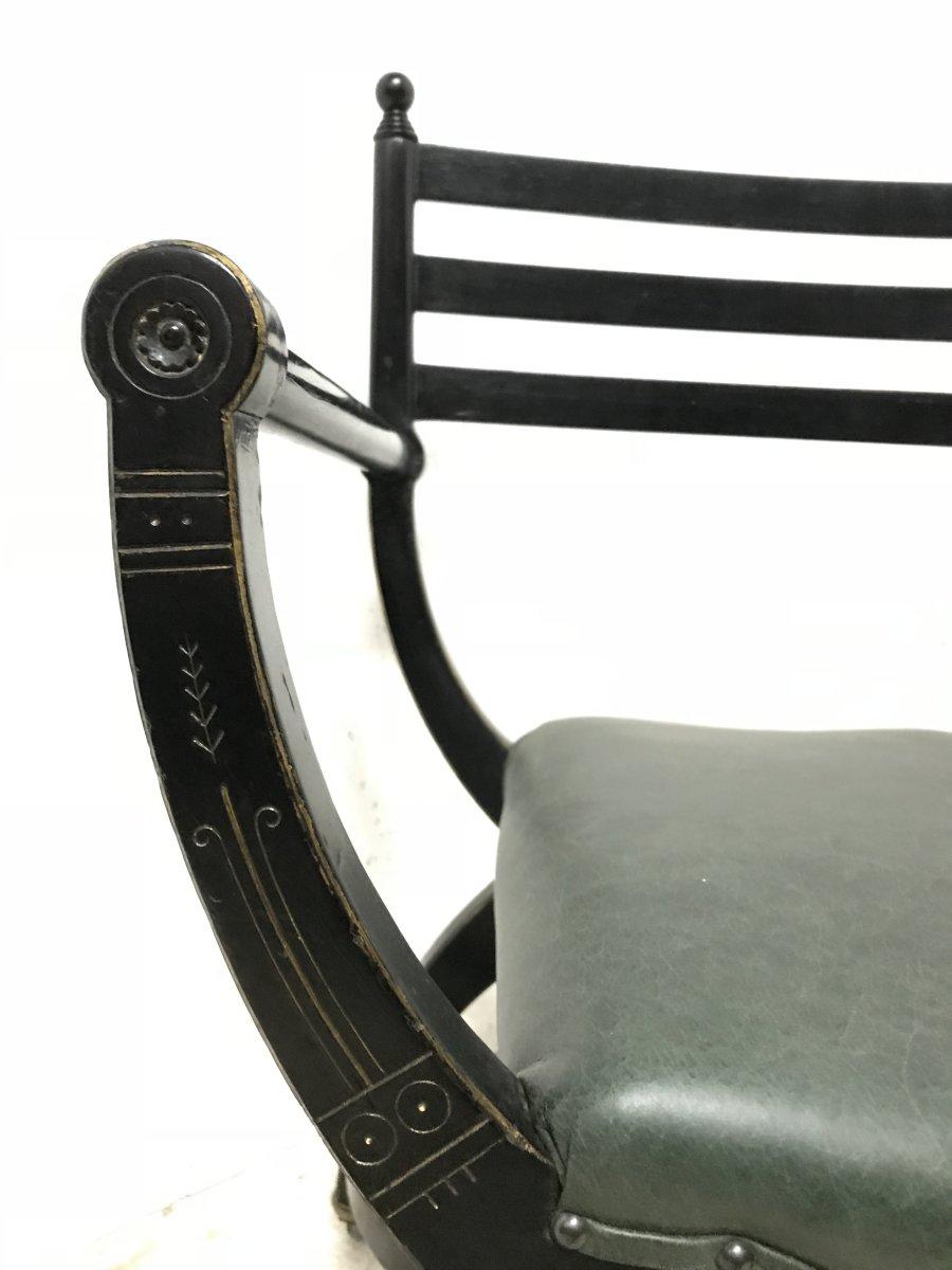19th Century Richard Charles Aesthetic Movement Ebonised Elbow Chair with X Frame stretcher For Sale